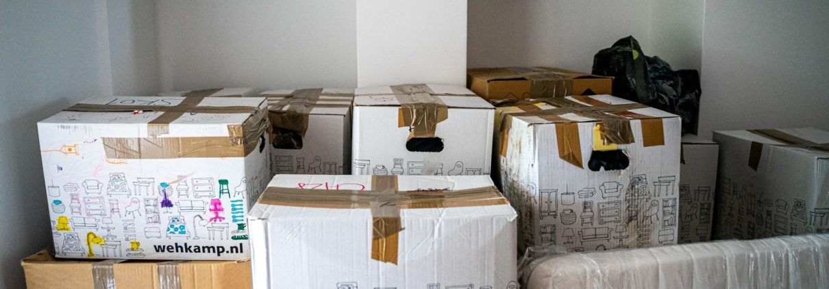 brown cardboard boxes on brown wooden table