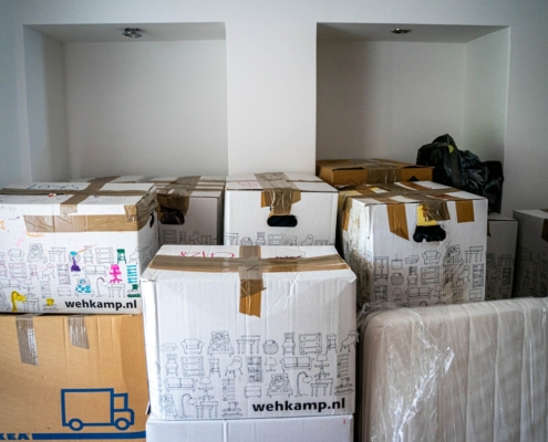 brown cardboard boxes on brown wooden table